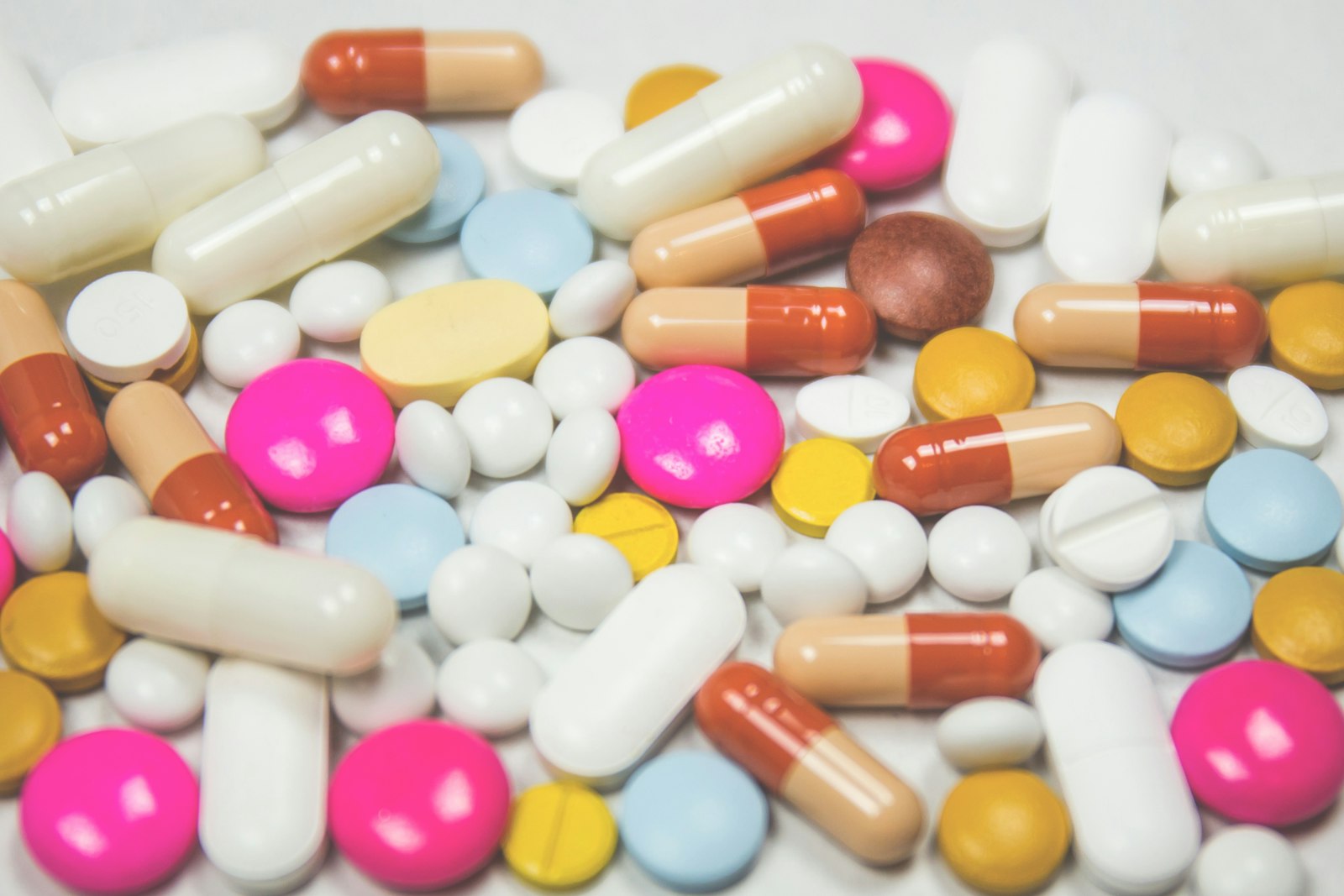 A close-up assortment of colorful tablets and capsules
