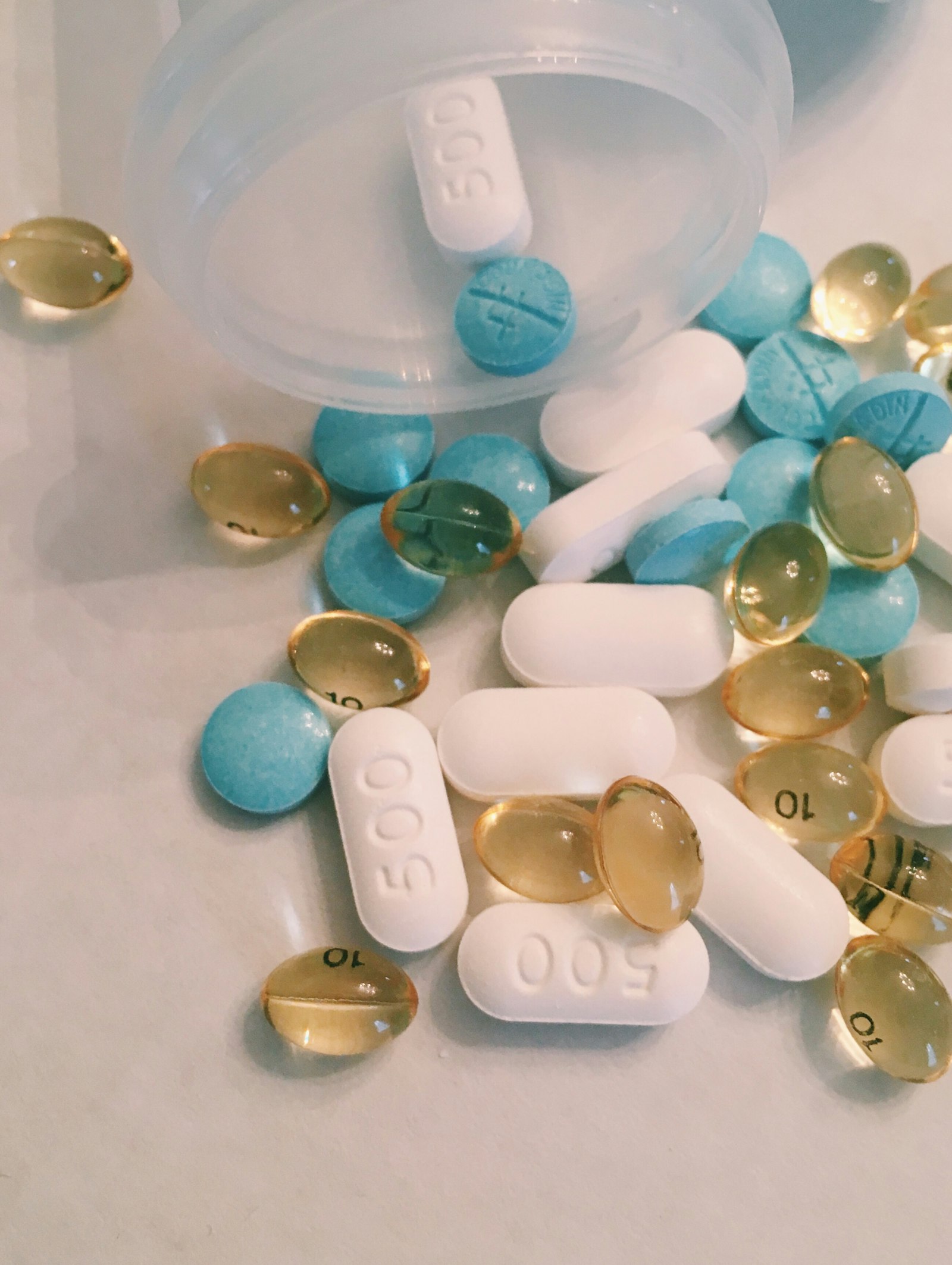 A bright close-up of colorful tablets and capsules
